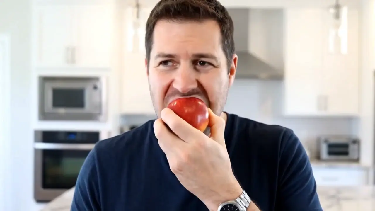 Man eating an apple
