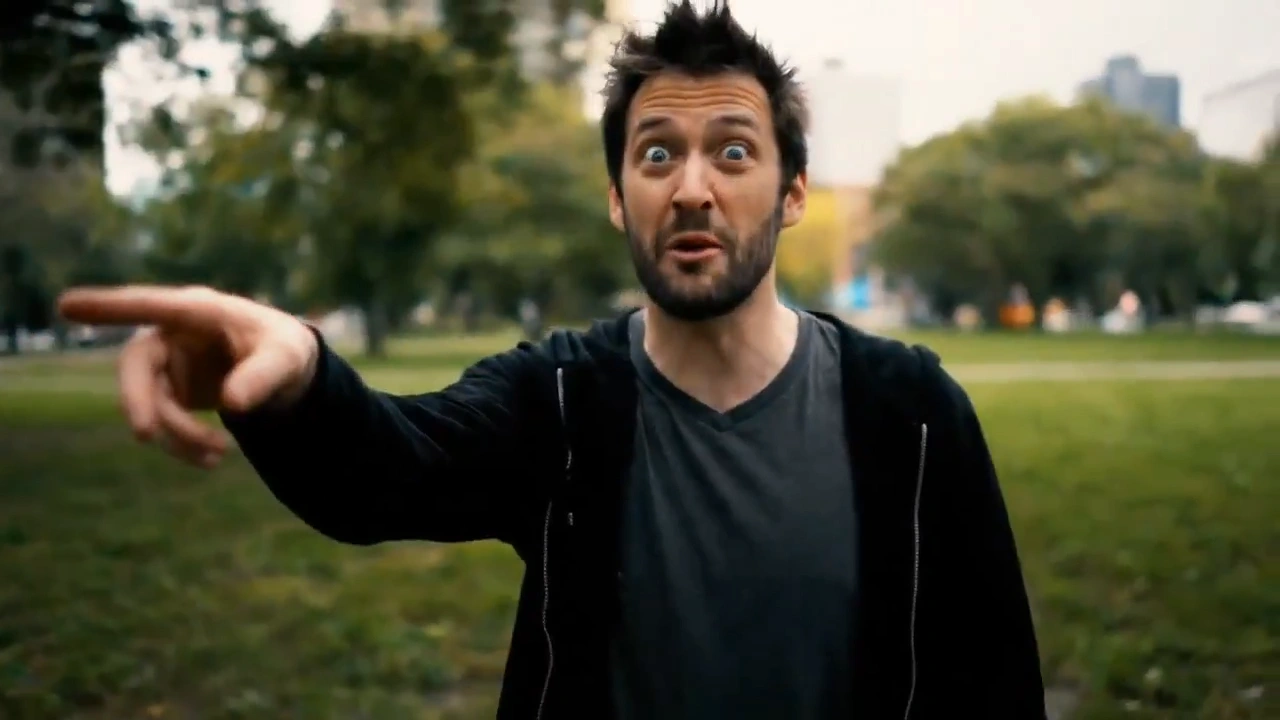 Man points at the dissolving scenery