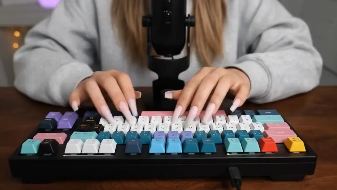 Asmr creator typing on a noisy keyboard