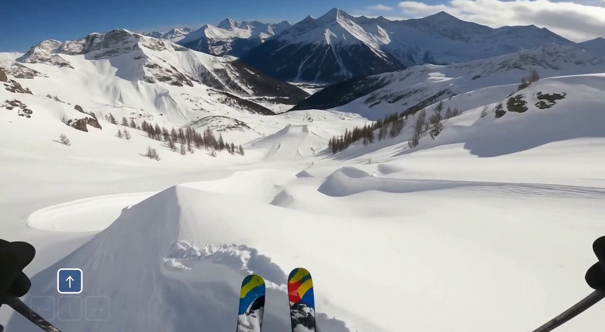 Another skier appears wearing a Genie 3 tshirt