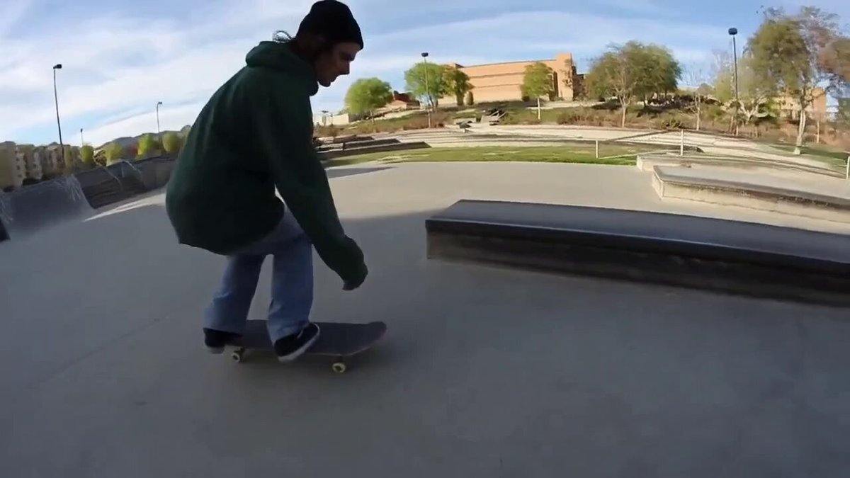 skateboarder does a kickflip